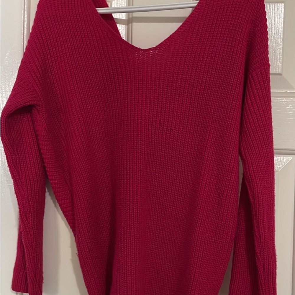 Pink sweater with a bow at the back